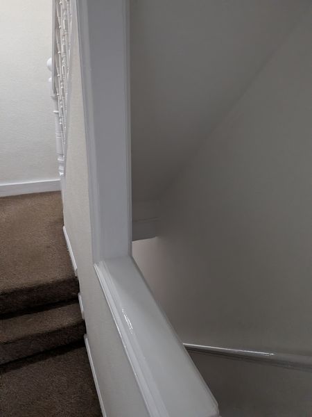 Landing with a white-painted banister and walls